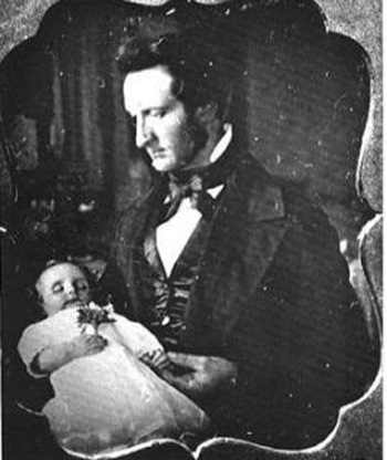 A portrait of a Victorian father with a new baby