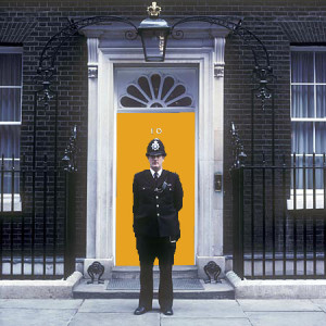 The orange front door of number ten ( 10 ) Downing Street - the British (Britain, UK, United Kingdom,Great Britain) Prime Minister's residence.
