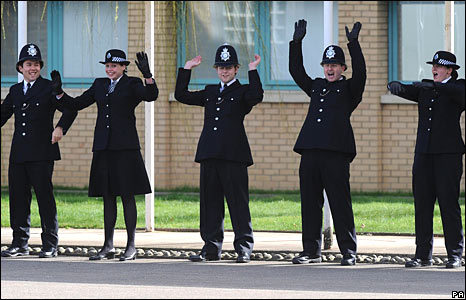 Uniformed British Police doing a Mexican Wave